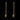 Gold threader earrings with lightning bolt charms on a black background