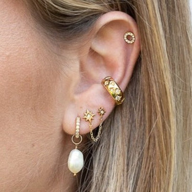 chained star stud earrings by Scream Pretty