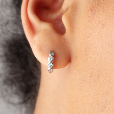 Bezel Huggie Earrings with clear stones in Silver by Scream Pretty